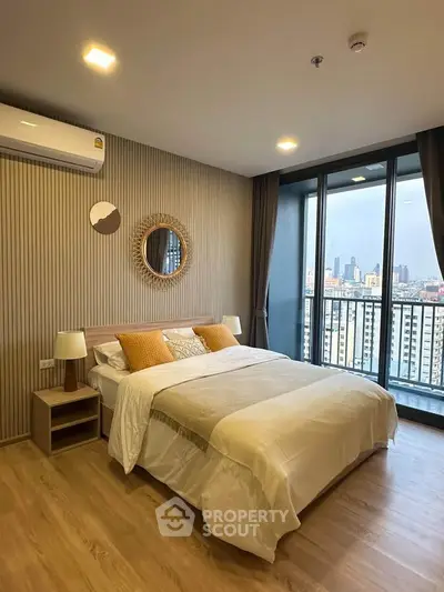 Modern bedroom with city view and stylish decor in high-rise apartment