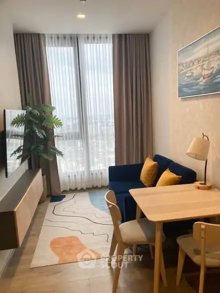 Modern living room with stylish decor and large window view