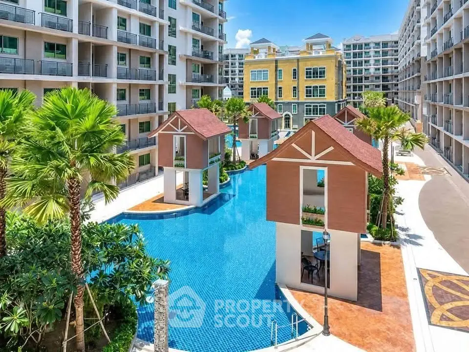Luxurious condominium complex with stunning pool and unique architecture, perfect for modern living.
