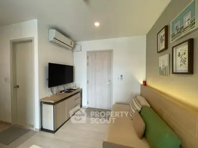 Modern living room with stylish decor and wall-mounted TV, perfect for cozy relaxation.