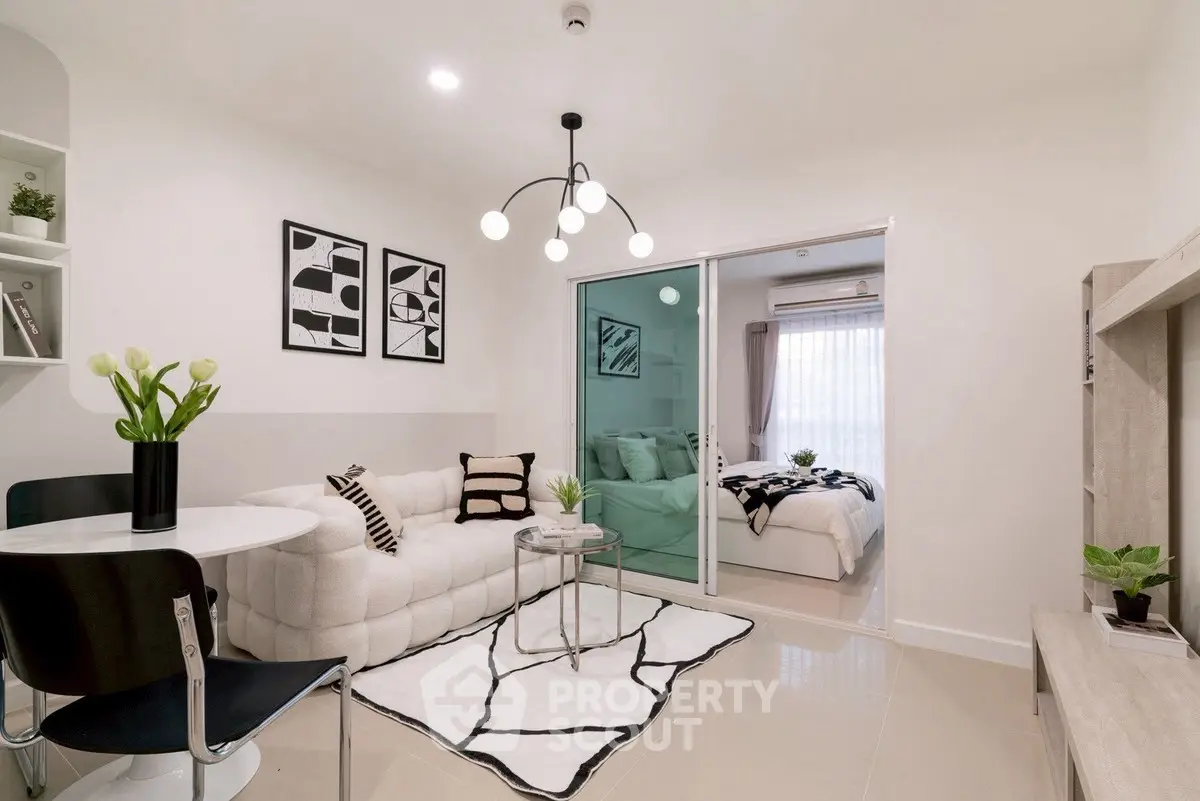 Modern living room with stylish decor and cozy bedroom view