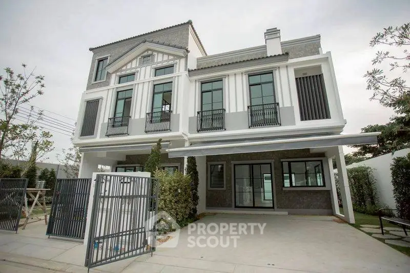 Elegant modern townhouse with spacious driveway and stylish facade