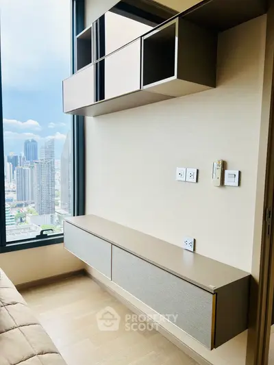 Modern bedroom with sleek storage and stunning city view