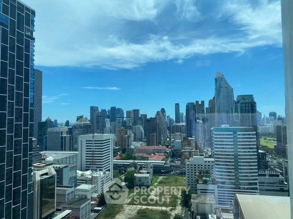 Stunning cityscape view from a high-rise building, showcasing modern architecture and vibrant urban skyline.