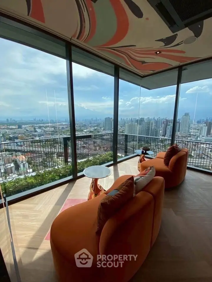 Luxurious living room with panoramic city view and stylish orange seating