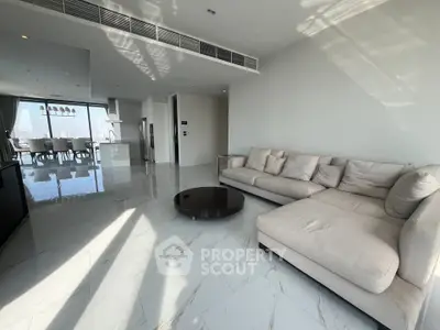 Spacious modern living room with open layout and city view