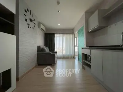 Modern living room with open kitchen and large window view