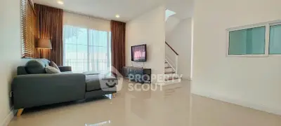 Spacious modern living room with sleek design and natural light