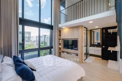Luxurious modern bedroom with mezzanine and large windows offering stunning views