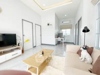 Bright modern living room with stylish decor and cozy seating area