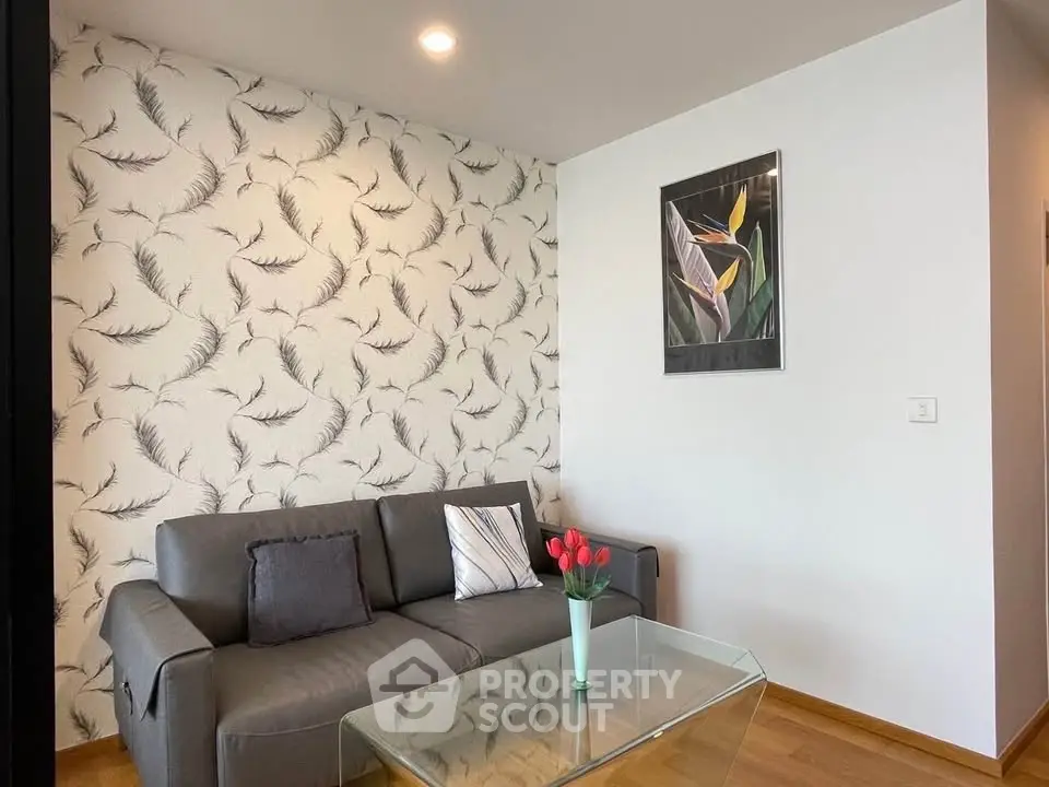 Modern living room with stylish wallpaper and sleek furniture