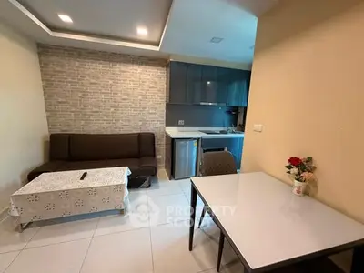 Cozy living room with modern kitchen in open layout apartment