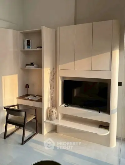 Modern living room with built-in TV unit and cozy study nook