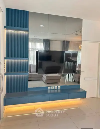 Modern living room with sleek TV unit and stylish decor