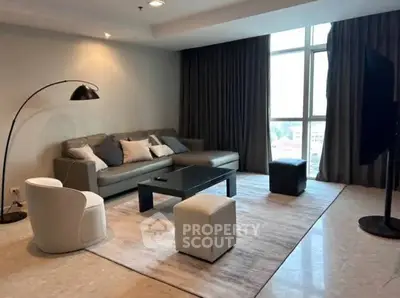 Spacious modern living room with large windows and stylish furniture