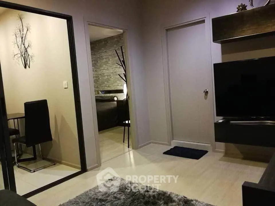 Modern living room with sleek decor and cozy bedroom view