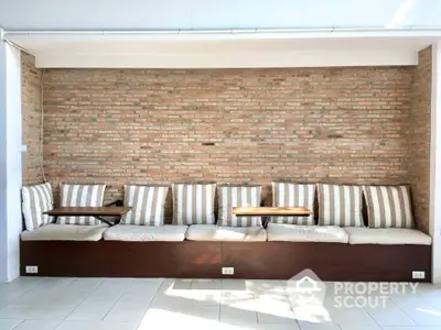 Stylish living room with brick accent wall and cozy seating area