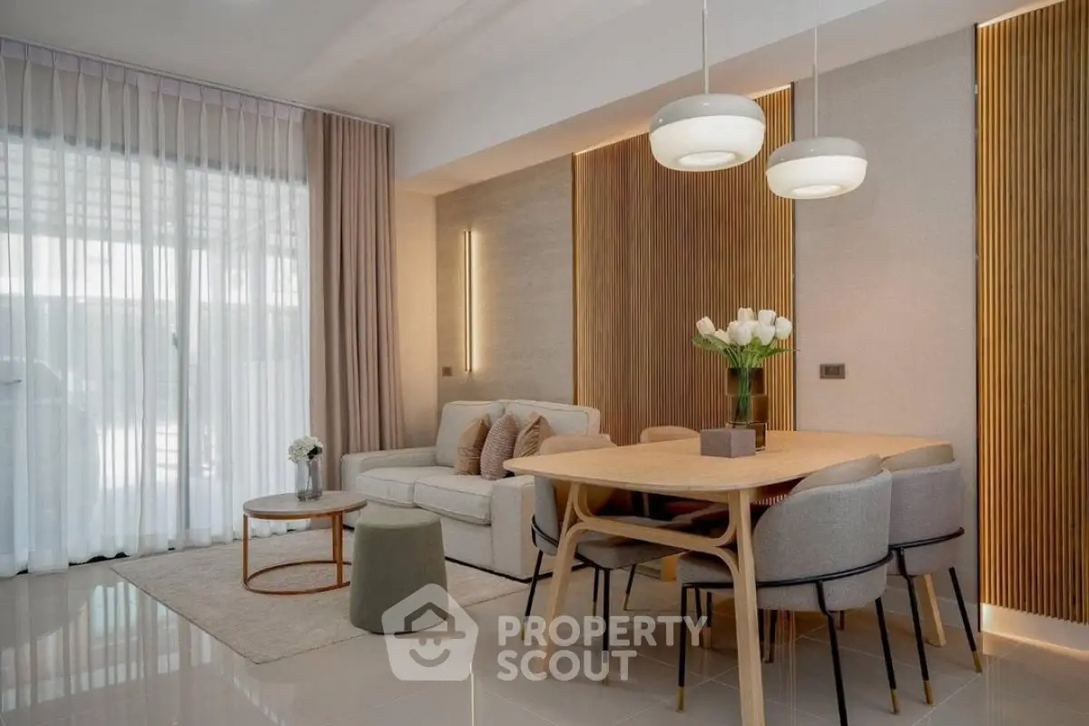 Modern living room with elegant dining area and stylish lighting