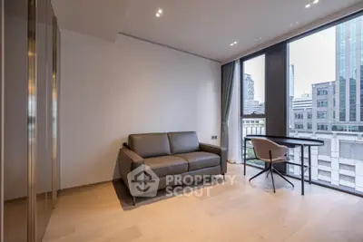 Modern living room with sleek sofa and city view from large windows