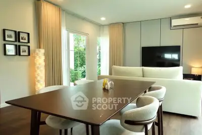 Modern living room with elegant dining area and stylish furniture