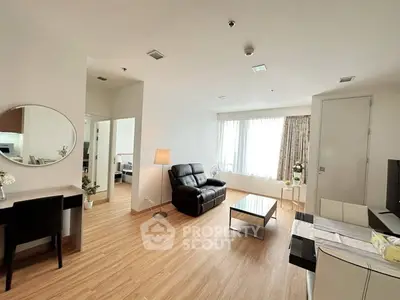 Spacious modern living room with wooden flooring and elegant decor