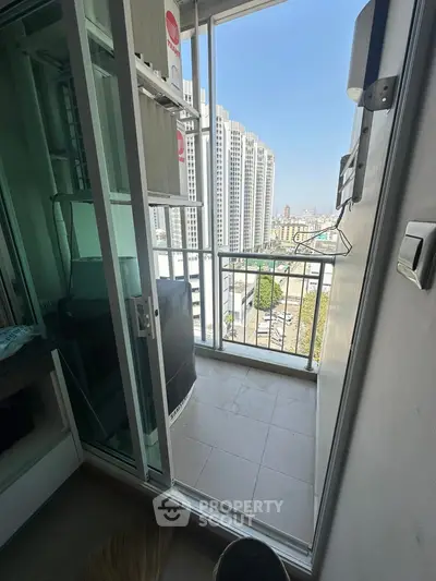 Compact balcony with city view in modern high-rise apartment