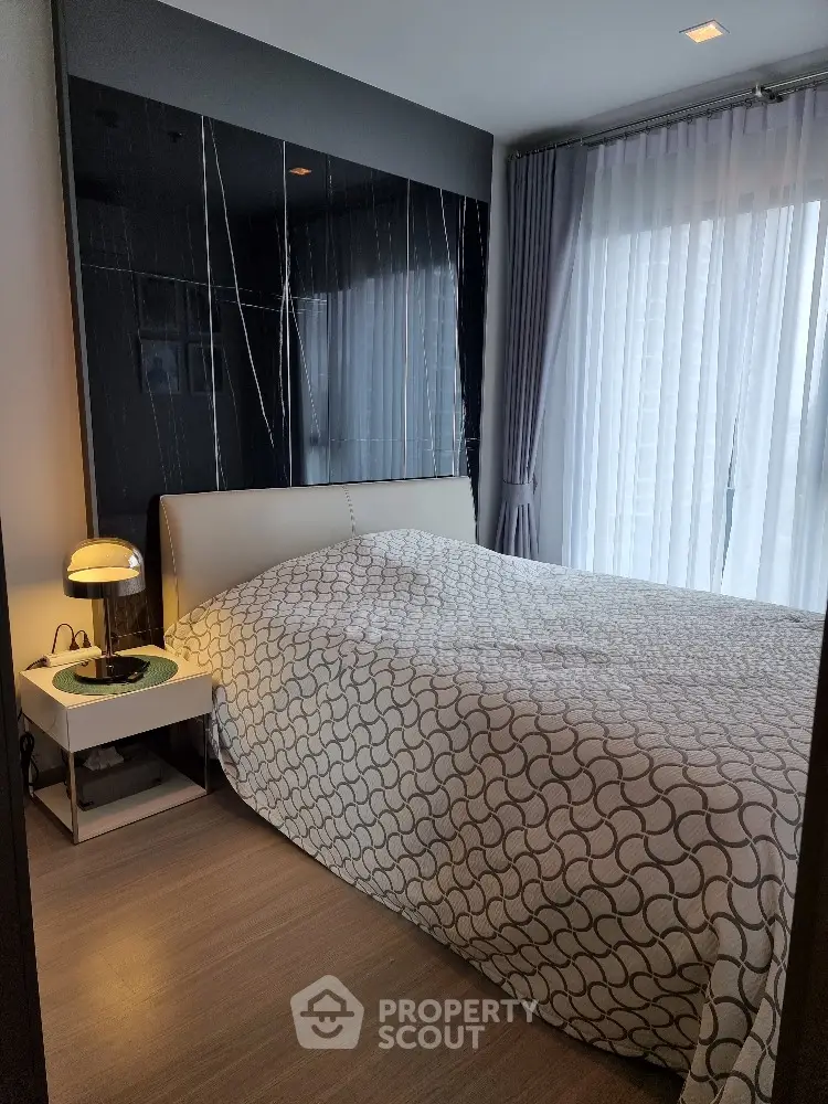 Cozy modern bedroom with stylish decor and natural light