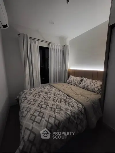 Cozy modern bedroom with stylish bedding and ambient lighting