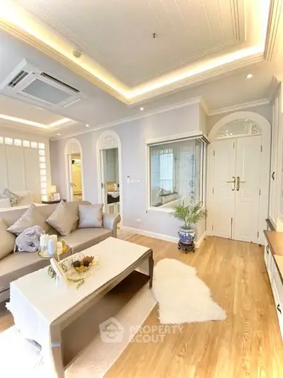 Elegant living room with modern decor and cozy seating area