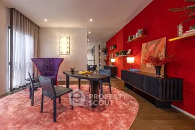 Stylish modern living room with vibrant red accents and elegant furniture