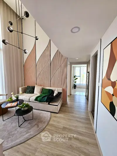Stylish modern living room with artistic wall design and cozy seating area