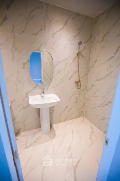 Modern bathroom with elegant marble tiles and sleek fixtures
