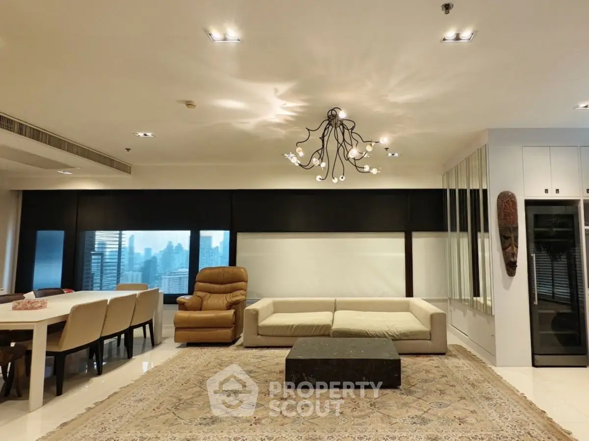 Luxurious living room with modern chandelier and city view