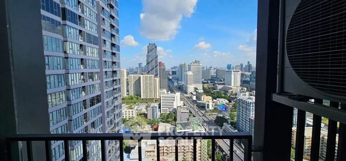 Stunning cityscape view from a high-rise balcony, perfect for urban living.