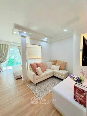 Chic living room with cozy sectional sofa and elegant decor, perfect for modern living.