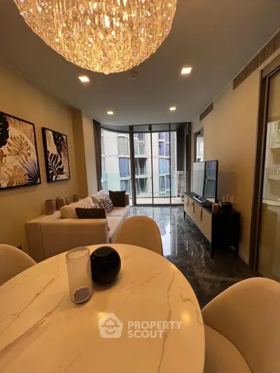 Luxurious living room with elegant chandelier and modern decor in high-end apartment