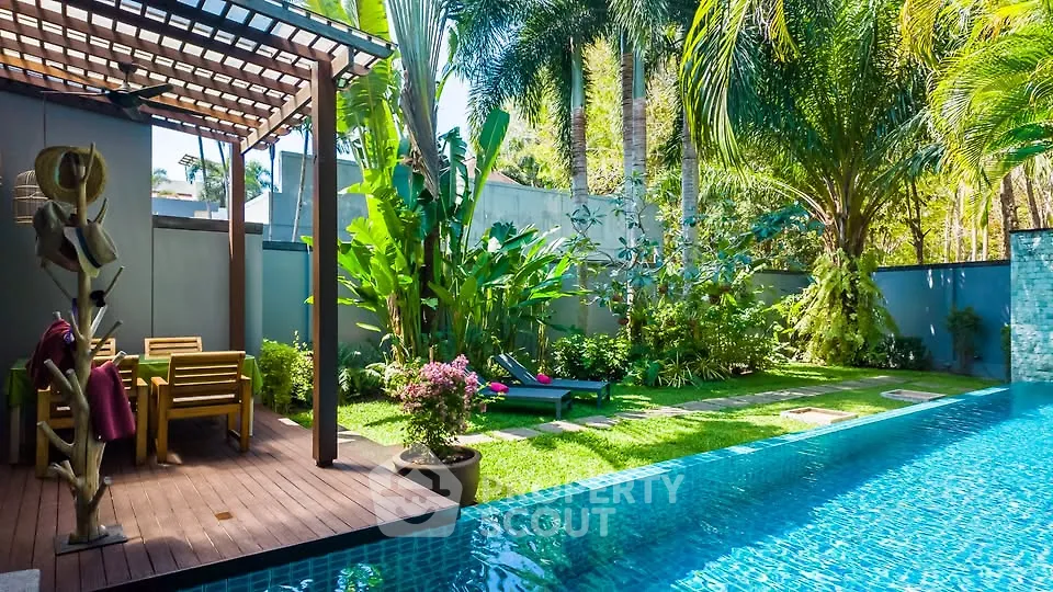 Luxurious tropical backyard with sparkling pool and lush garden oasis