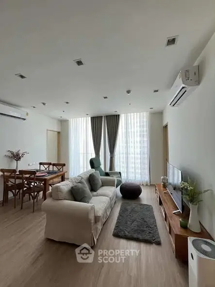 Spacious modern living room with elegant decor and natural light