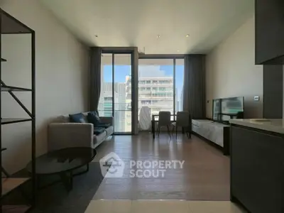 Modern living room with large windows and city view, featuring sleek furniture and open layout.