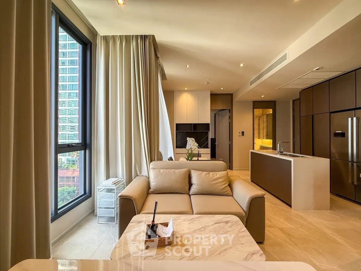 Luxurious modern living room with open kitchen and stunning city view