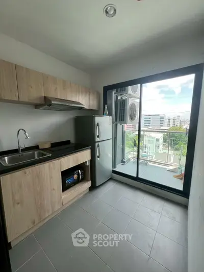 Modern kitchen with sleek design and large windows for natural light