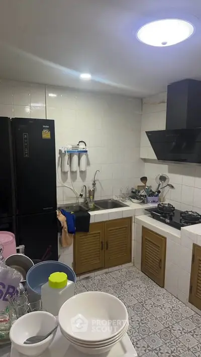 Charming kitchen with modern appliances and ample storage in a cozy home setting.