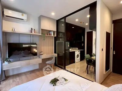 Modern studio apartment with open kitchen and cozy living area