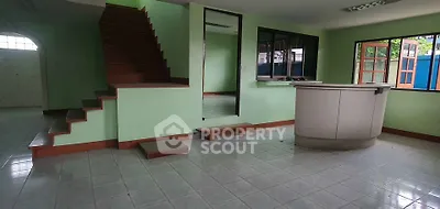 Spacious interior with tiled flooring and staircase, ideal for modern living.