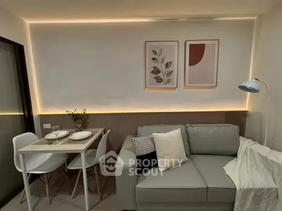 Cozy modern living room with stylish decor and dining area, perfect for urban living.