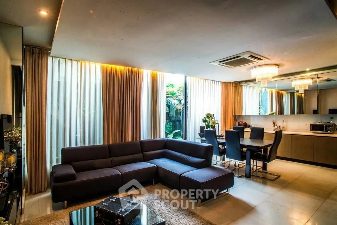 Luxurious modern living room with elegant dining area and stylish lighting