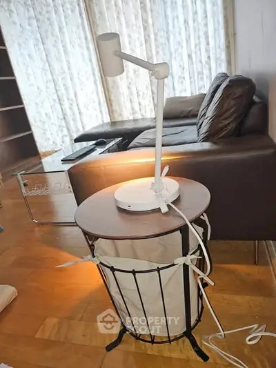 Modern living room with stylish furniture and unique lamp design