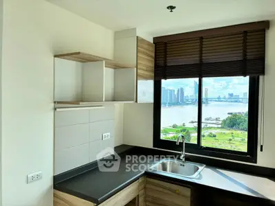 Modern kitchen with stunning river view and sleek cabinetry