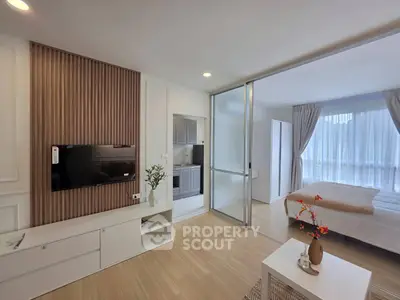 Modern studio apartment with open layout, featuring a cozy bedroom and stylish living area.