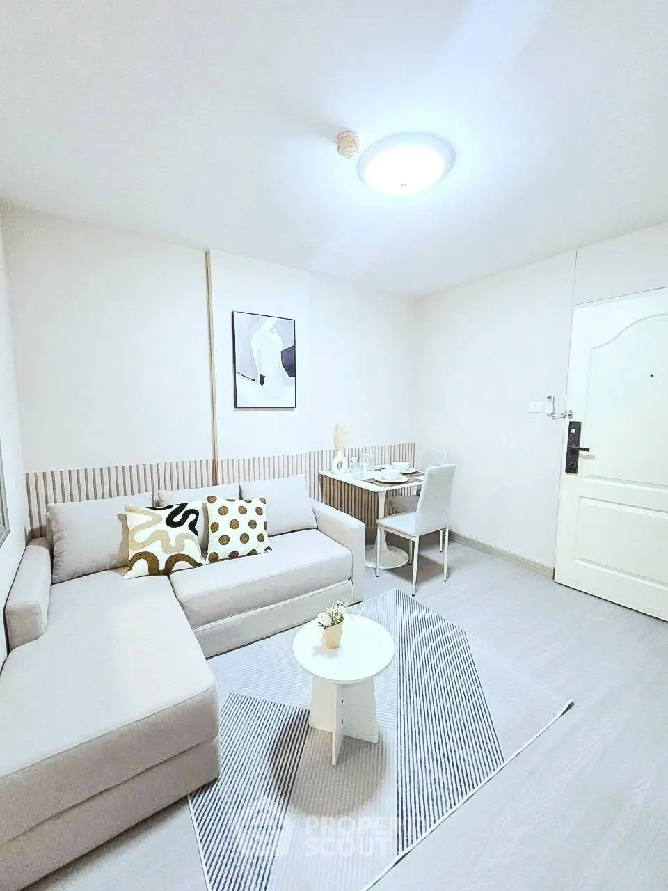 Bright and modern living room with stylish decor and cozy seating area.